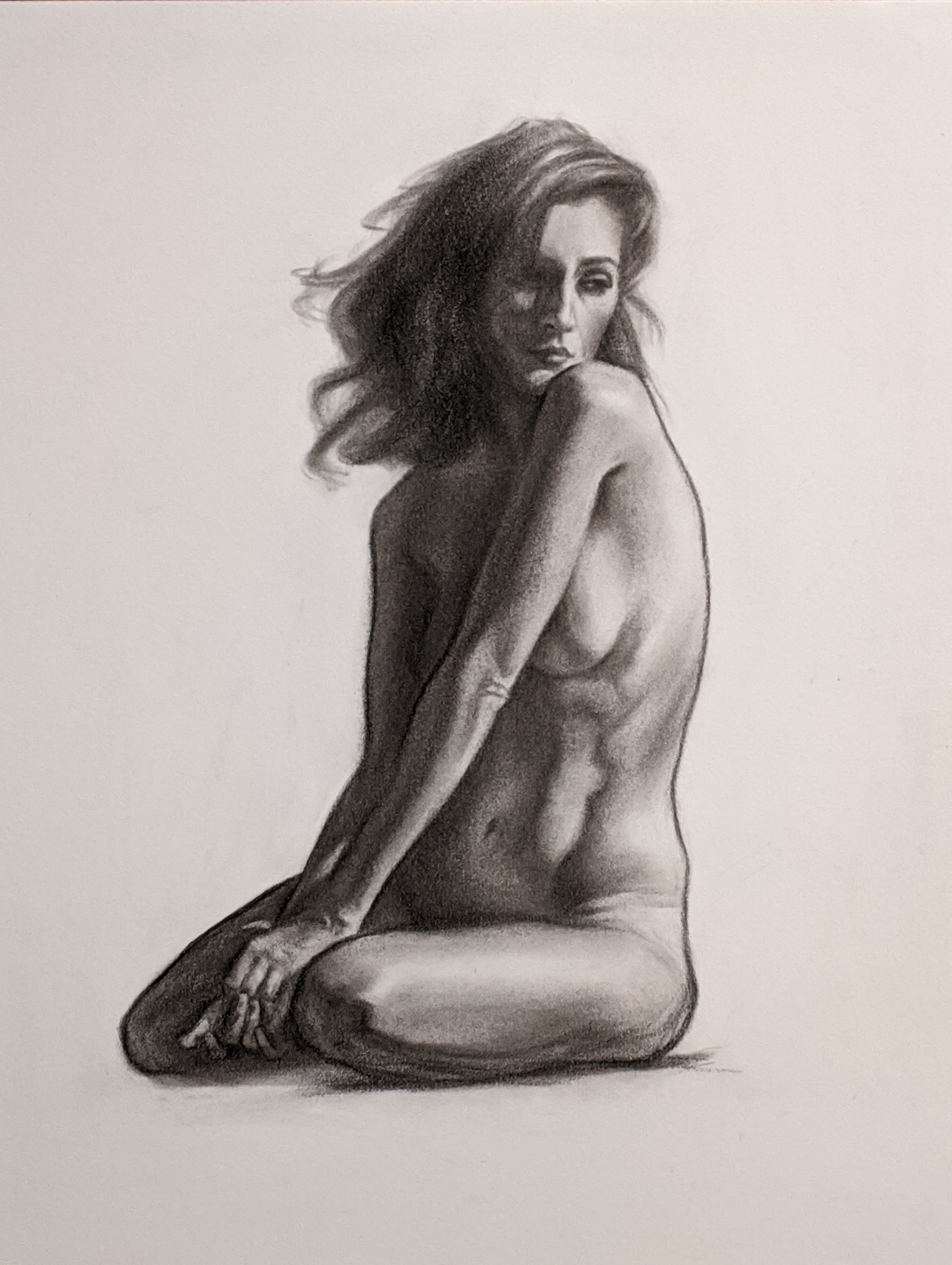 Charcoal drawing of a nude woman posing dramatically