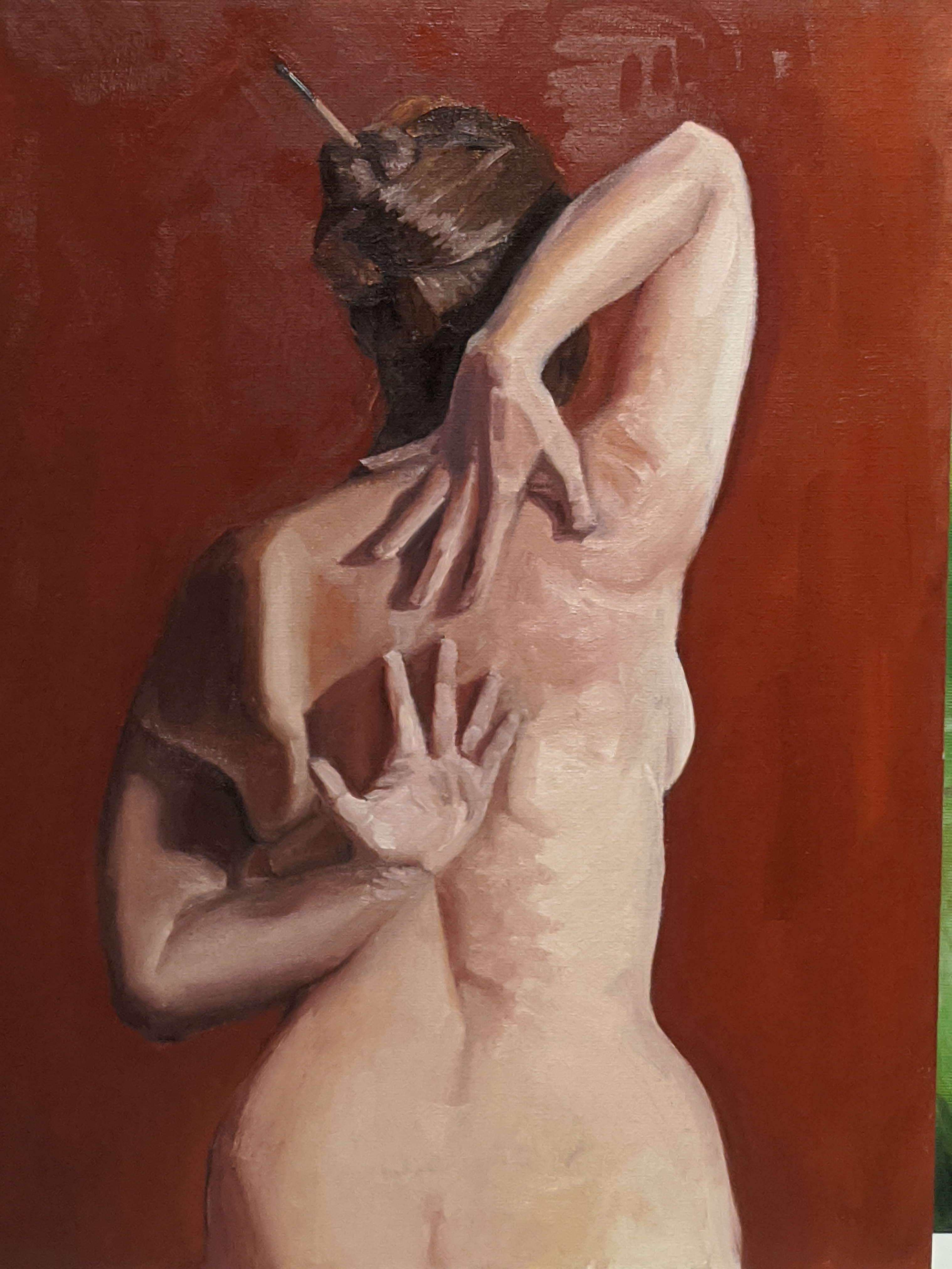 Oil painting of a woman's back from the waist-up. Arms are reaching behind her and her hands are almost touching. Woman is white, background is red, and her hair is being held in place with a paintbrush.