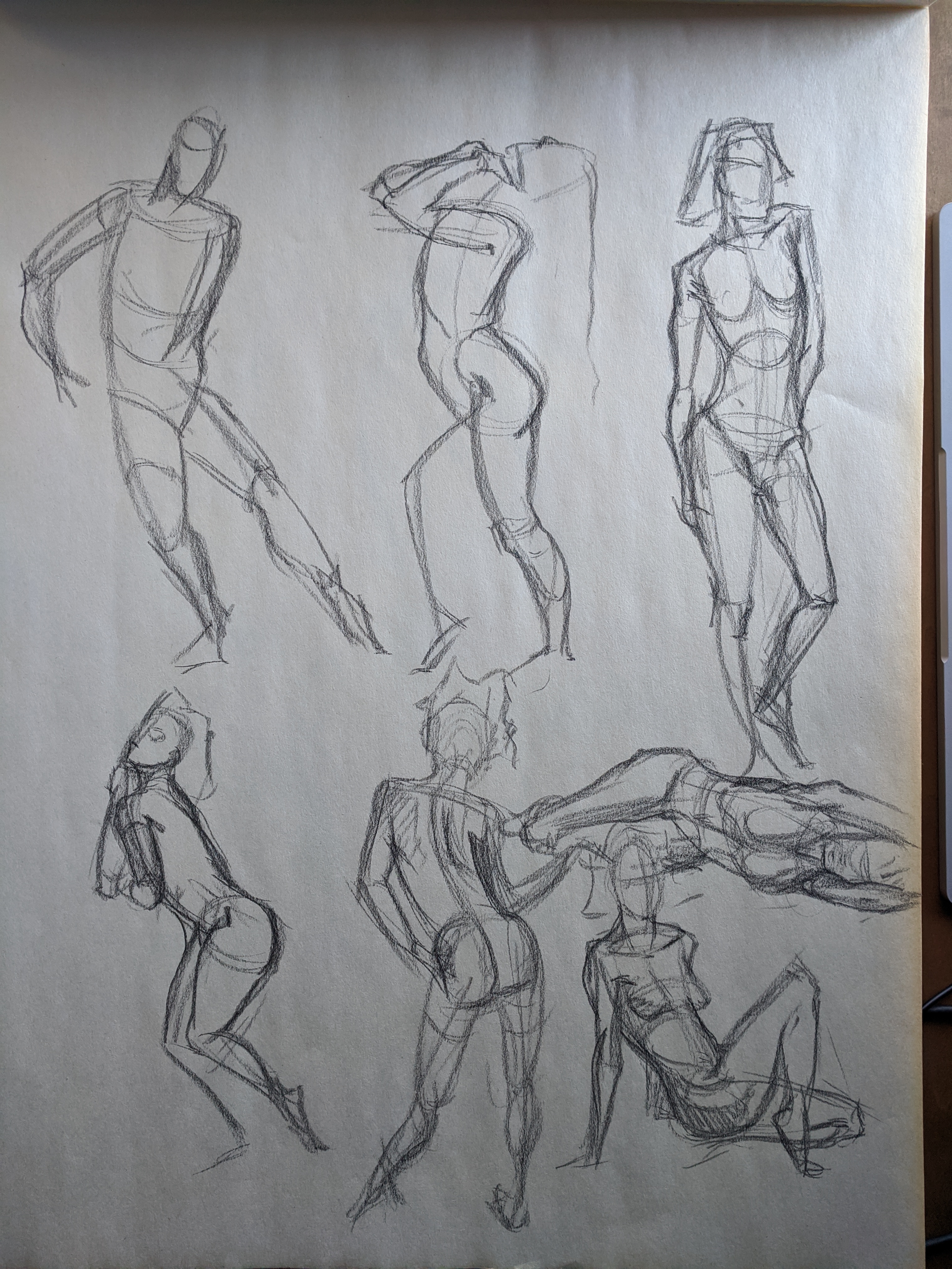 Graphite page of quick figure studies in varied poses