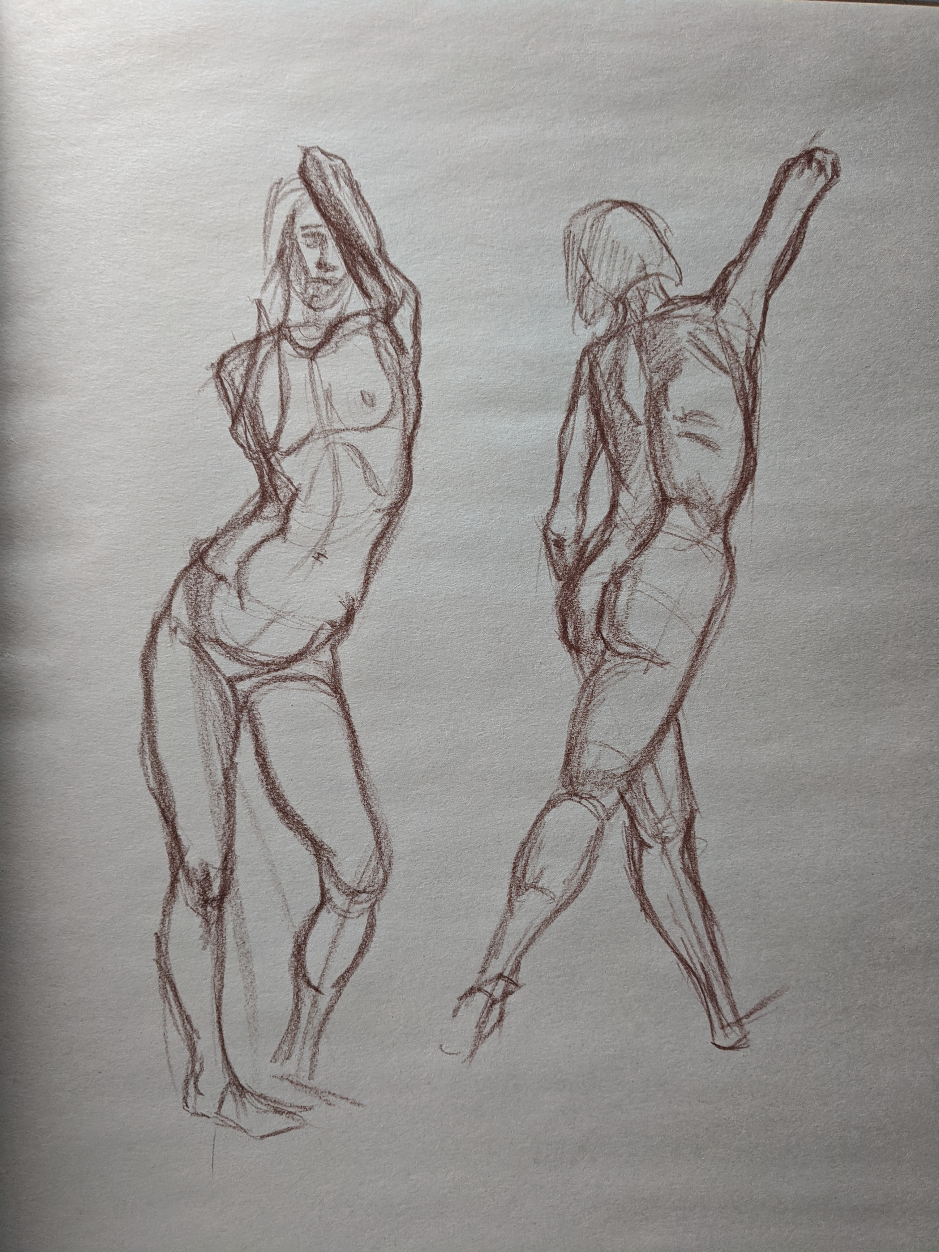 Red chalk studies of two seated figures in relaxed poses