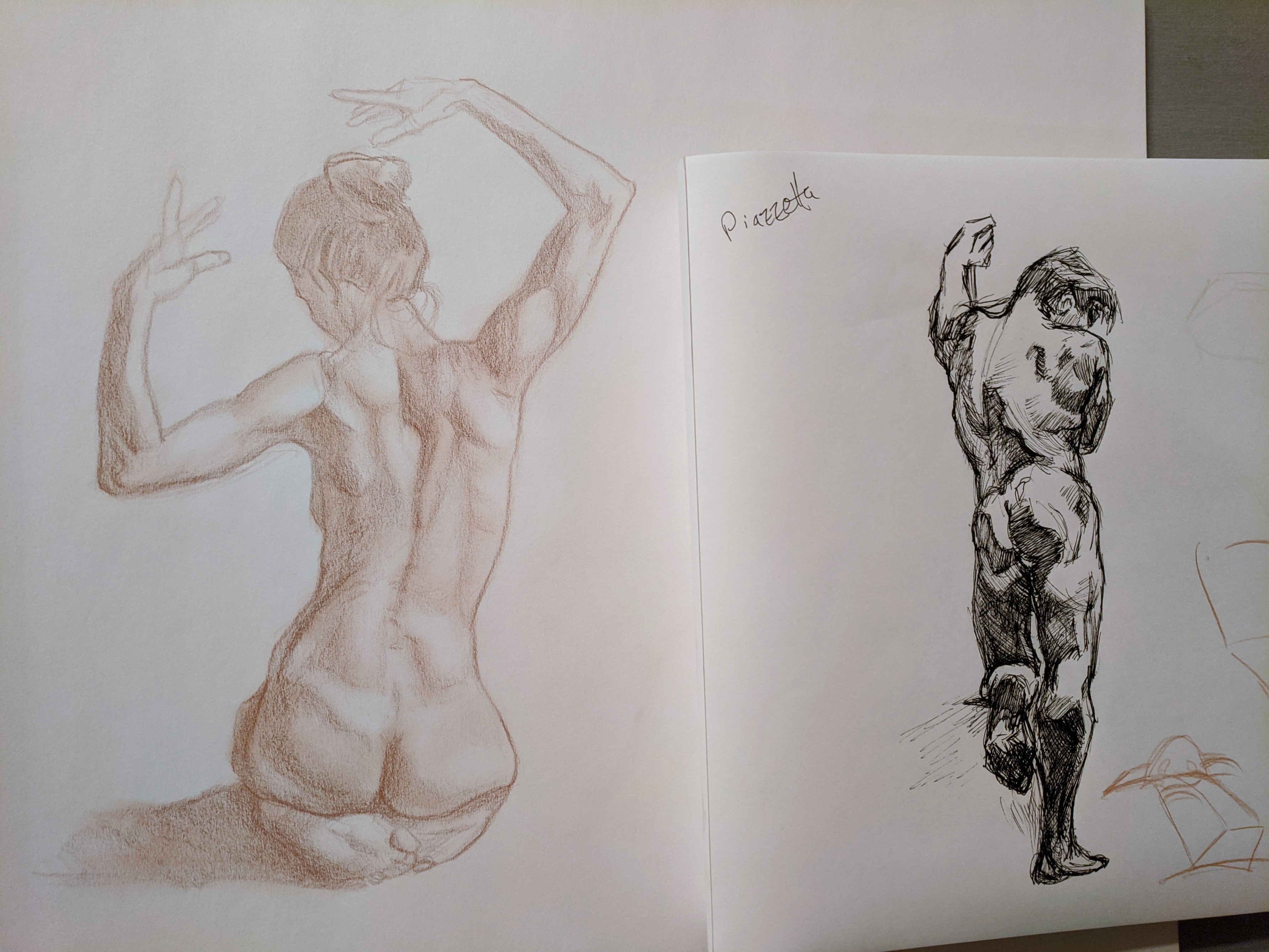 Sketchbook spread with figure gestures and a dark ink standing figure